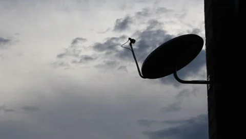 Satellite TV Dish with Sunset Backdrop  (HD) Stock Footage 8811220