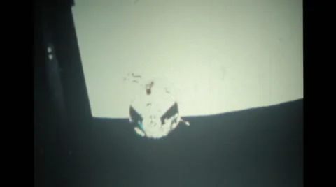 Satellite view of the surface of the moon and a spacecraft Stock Footage 39909140