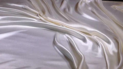 Satin sheet falls on bed Stock Footage 98577028