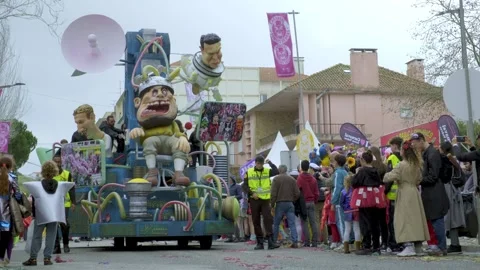 Satirical parade float in town street in carnival of Torres Vedras, Portugal Stock Footage 327743565