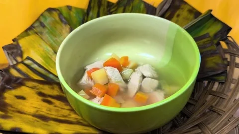The satisfaction of fresh vegetable soup in light green bowl. 001A 스톡 동영상 335607805
