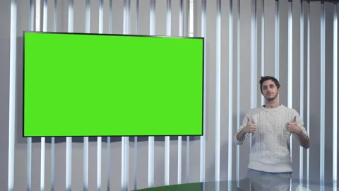 Satisfied boy does ok with his hands in front of a green screen Stock Footage 144246200