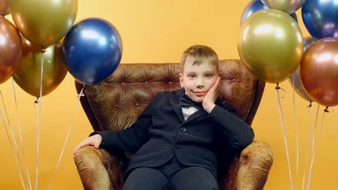 Satisfied boy looking at camera and smiling while celebrating birthday Stock-Footage 126125217