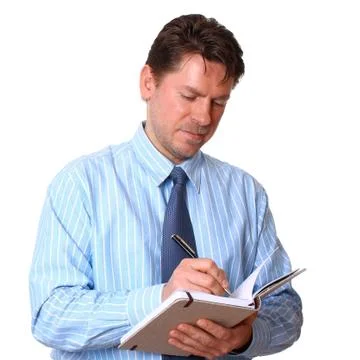 Satisfied employee writes notes in notebook Stock Photos