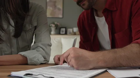 Satisfied financial adviser smile while client customer sign insurance Stock Footage 277553069