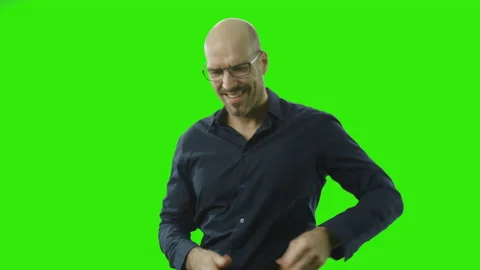 Satisfied guy looking at his phone in front of a green screen Stock Footage 166511373