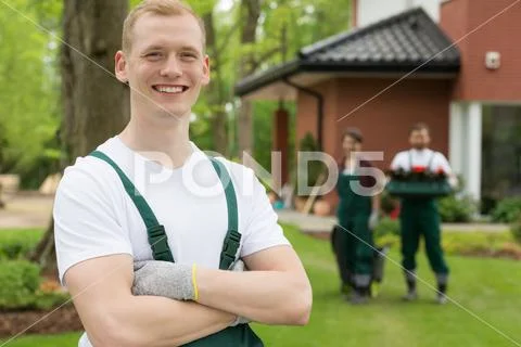 Satisfied leader of a gardeners' team Stock Photos