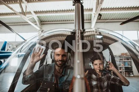 Satisfied male and positive child flourishing hands Stock Photos