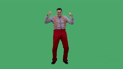 A satisfied man dances with his hands up, clenched fists and points his fingers Video stock 153661482