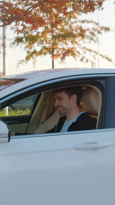 Satisfied man gets into vehicle ordered through car sharing Stock Footage 300551834