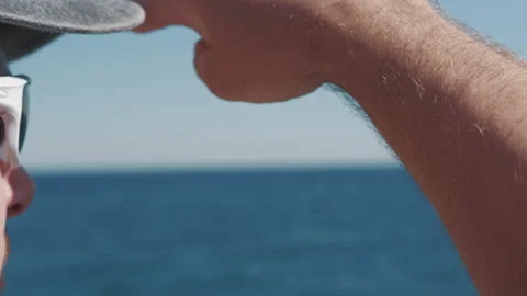 Satisfied man standing on mountain top and look into the distance Stock-Footage 137875671