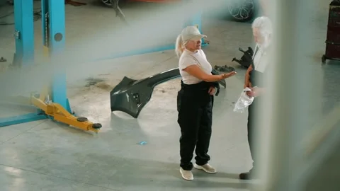 Satisfied Mechanic workers making high five gesture after finishing work Stock Footage 195545293