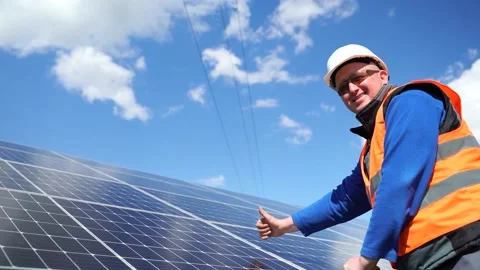 Satisfied solar power station worker showing thumb up. Engineer gestures abou Stock Footage 168178388