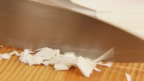 Satisfying ASMR white paper cutting on wooden surface with paper pile Stock Footage 309853797
