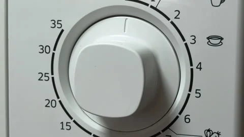 Satisfying Microwave Timer Winds Down and Ends with a Final Mechanical Ding Stock Footage 329087484