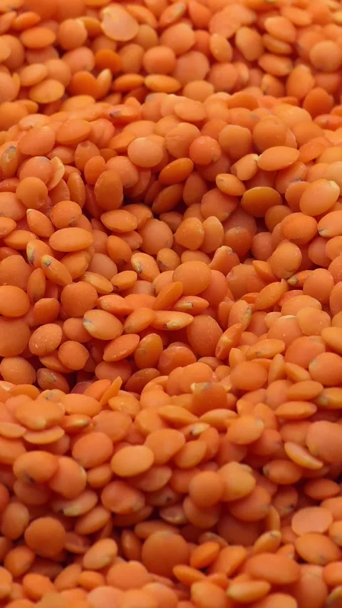 Satisfying red lentils pattern Stock Footage 327870362