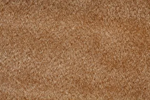 Saturated beige tissue background for your design. Stock Photos