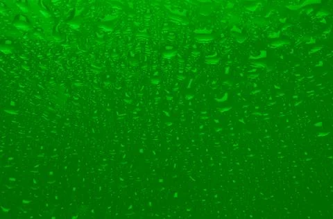 Saturated green wet texture with gradient and drops. Acid summer or nuclear w Stock Photos