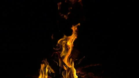 Saturated yellow fire of campfire at night, 8x 240 fps slow motion Stock-Footage 86282839