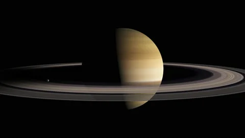 Saturn half lit with the rings in shadow 스톡 동영상 131151271