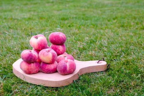 Saturn Peach on a Serving Board Stock Photos