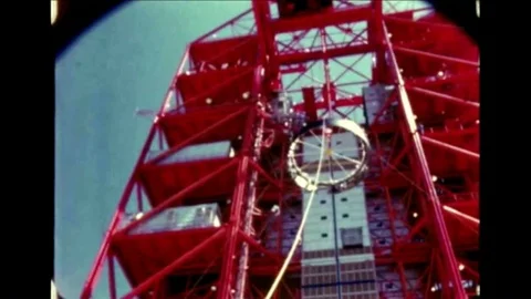 Saturn rocket components are lowered, mounted, assembled and positioned at Cape Stock Footage 95243313