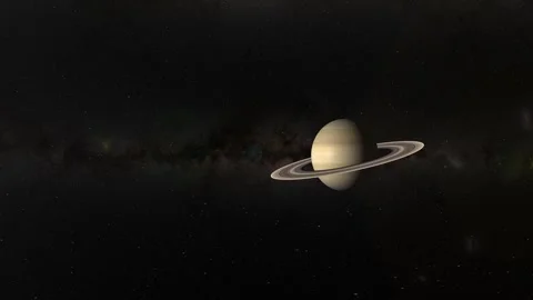 Saturn rotating in deep space with its iconic rings, illuminated by distant.. 스톡 동영상 333486132