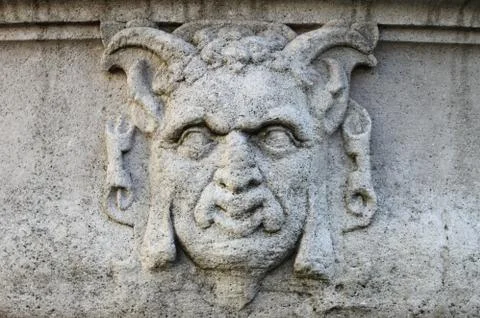 Satyr mask basrelief Stock Photos