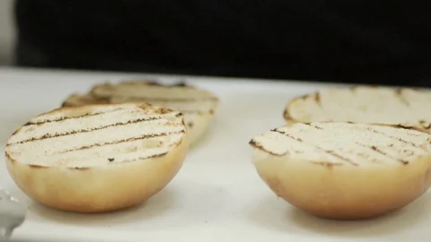 Sauce being added on buns Stock Footage 109392260