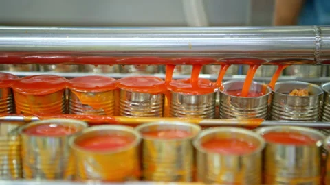 The sauce filling point into cans is one step in the process Stock Footage 339004775