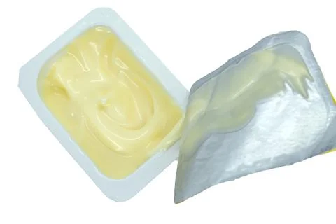 Sauce in a mini container on a white background close-up Foto stock
