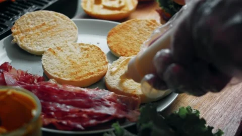 Sauce pattern forming on toasted bread in close-up, 4K Stock Footage 341117661