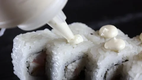The sauce pours on the rolls the slow motion soy rice sushi Stock Footage 168341898