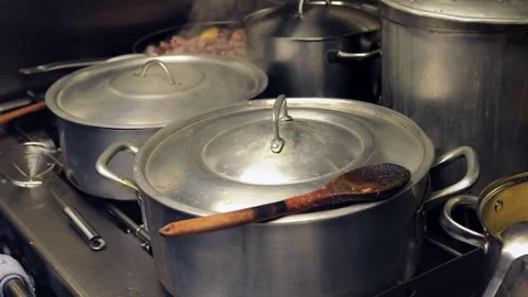 Saucepan boiling in a kitchen Stock Footage 72976127