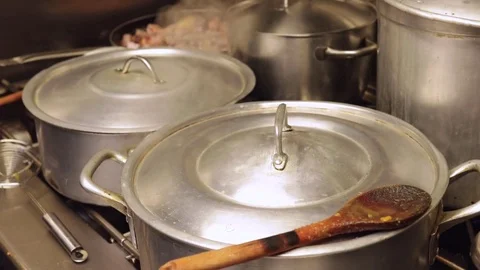 Saucepan boiling in a kitchen Stock Footage 72976141