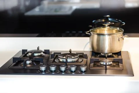 Saucepan on the stove Stock Photos
