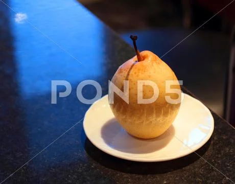 Saucer with a pear Stock Photos
