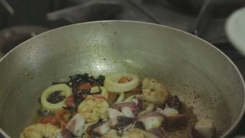 Saucing seafood in a pan Stock Footage 88440737