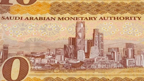 Saudi Arabia 10 riyal notes tracking. Slider shot. Low angle, macro. 4K Stock Footage 125985817