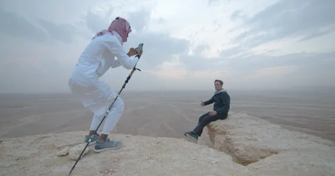 Saudi-Arabia Riyadh Edge-of-the-World-Tourist-and-Guide1B 422 59 Stock Footage 129506606