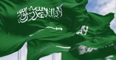 Saudi Arabian flags with Arabic calligraphy waving in the wind. 3D render Stock Illustration