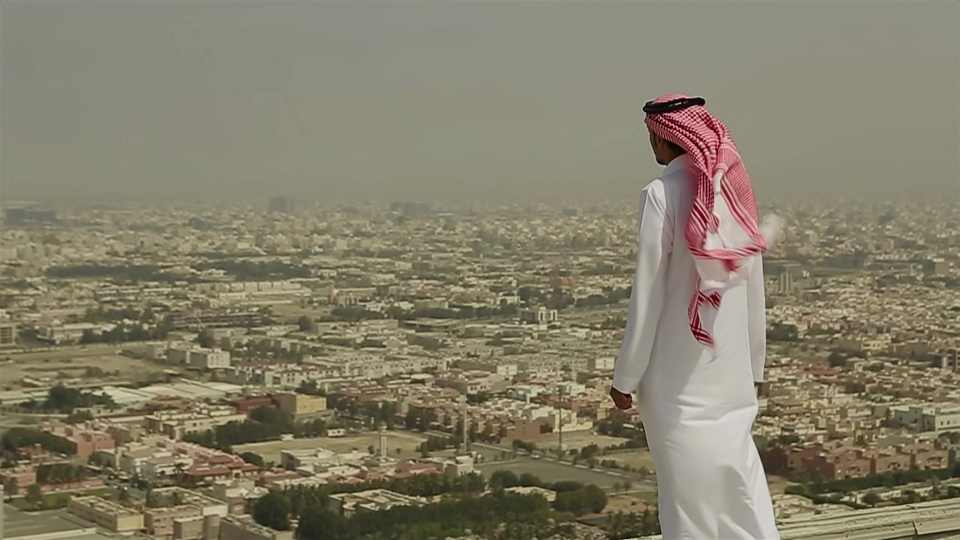 Saudi Arabian man standing on a roof in ... | Stock Video | Pond5