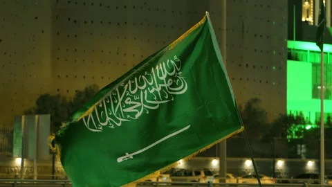 Saudi Flag Waving at Night During National Day Celebration Stock Footage 309779875