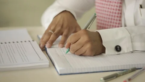 Saudi man hands while studying or working in room at day time Stock Footage 102388089