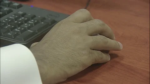 Saudi Man hosing Mouse working on  computer in office Video stock 82779271