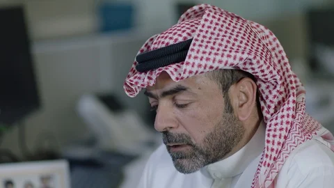 Saudi man listens Stock Footage 121903707