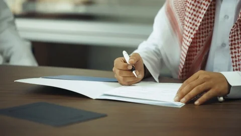 https://images.pond5.com/saudi-man-signing-contract-business-footage-112943219_iconl.jpeg?utm_source=chatgpt.com