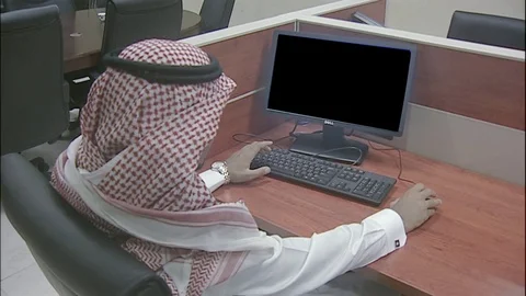 Saudi man working of computer in office Video stock 82819473
