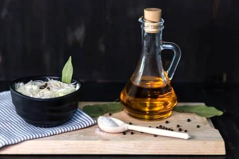 Sauerkraut, fermented cabbage on a dark background wooden spoon Stock Photos
