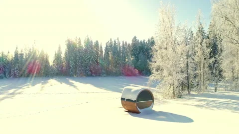 Sauna and cabin in snow in winter. Bright sunlight. Drone pullback. Stock Footage 218880628